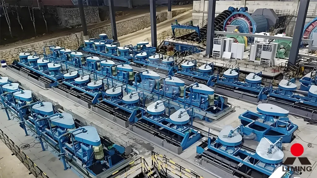 A heavy-duty ball mill operating in closed circuit with hydrocyclones to grind gold ore to the optimal liberation size for flotation
